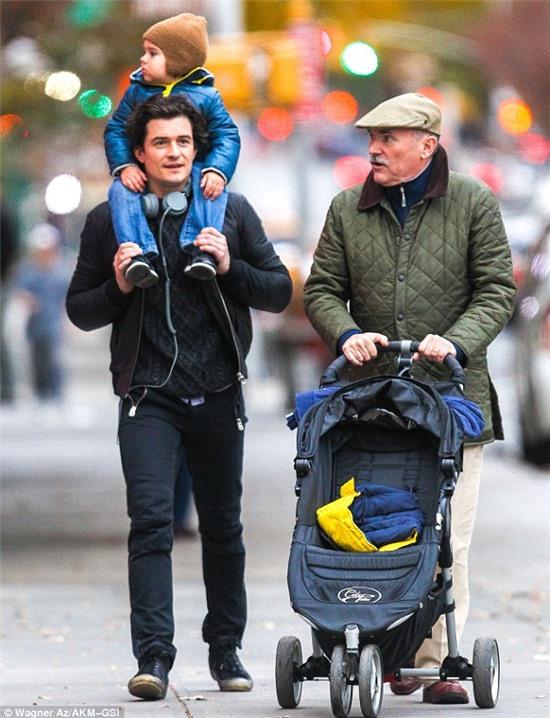 Doting fathers: Orlando Bloom stepped out in New York on Monday with his father Colin and son Flynn for a boy's day out 