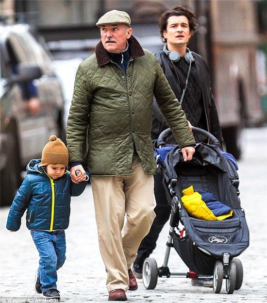 Co-coordinating coats: Orlando, Colin and Flynn all sported warm anoraks to keep out the Manhattan cold 