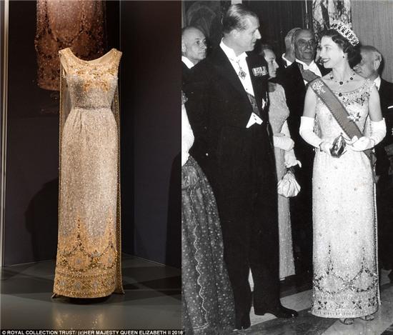 Made from duchesse satin, lace, sequins, diamante and beads, this asymmetric crinoline-skirted gown of pale yellow and turquoise - made by Sir Norman Hartnell, her favourite couturier of the time - is a perfect example of the Queen¿s Fifties fashions