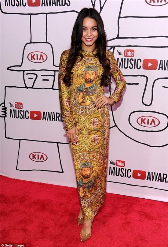 Style's higher power: The 24-year-old arrived at the New York awards' red carpet in a stunning long sleeved floor length gown