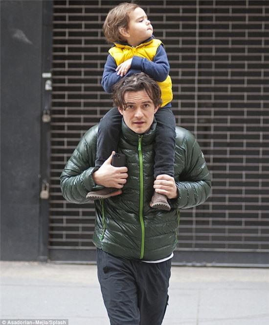 So cute: The 36-year-old actor hoisted his mini-me up on his shoulders as they took a stroll around the Soho area 
