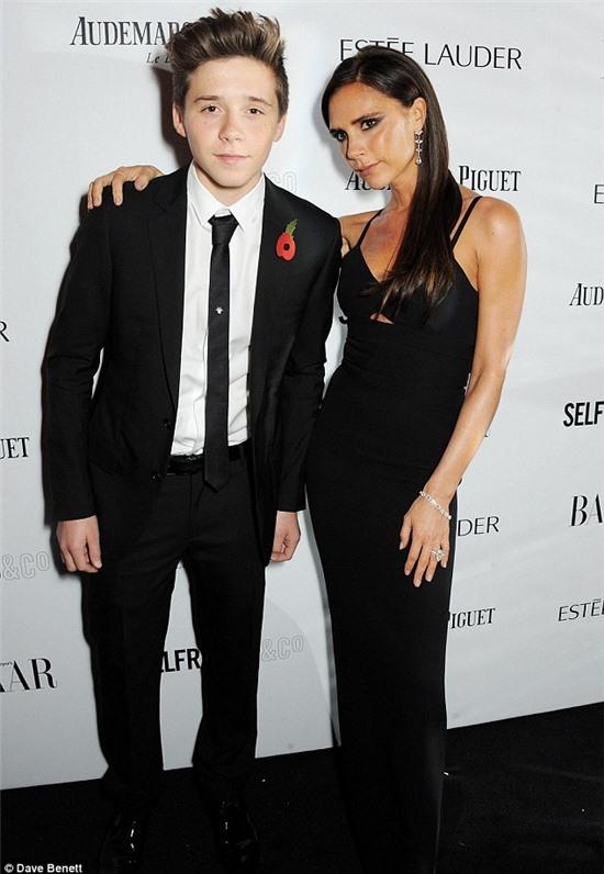 Style must run in the family: Featuring a daring plunging neckline, the chic ensemble showed off a hint of the mother-of-four's toned midriff with a cheeky cutaway design under the bust