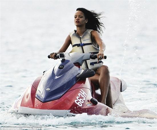 Safety first: The singer makes sure she puts on a life vest when speeding around on the jet ski