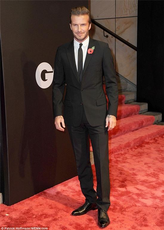 Dapper: David Beckham arrives at the Komishe Oper in Berlin ahead of the 15th Annual GQ Awards on Thursday evening
