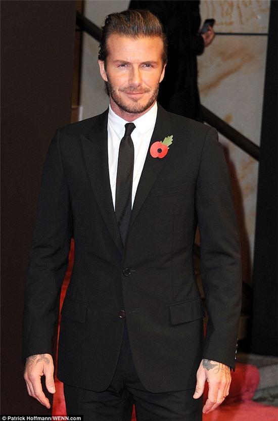 Main attraction: Beckham looks smart in a two-piece suit ahead of Thursday's awards ceremony