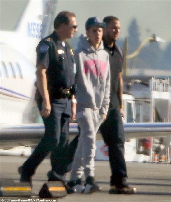 Getting processed: Justin Bieber's private jet was searched by custom officials when he arrived home to the U.S. on Wednesday at the Los Angeles International Airport