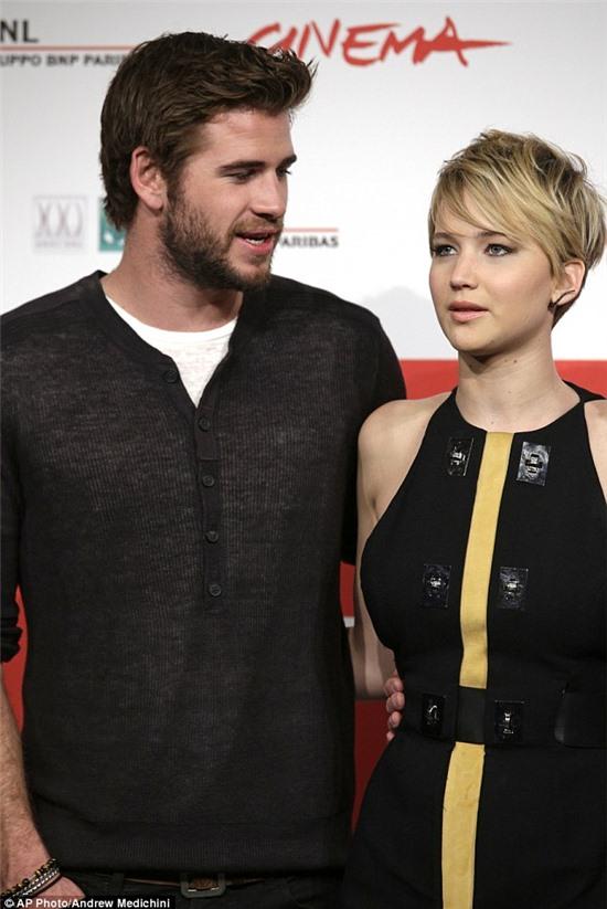 Nice work if you can get it: The pretty actress cosied up to Miley's ex fiancé Liam Hemsworth 
