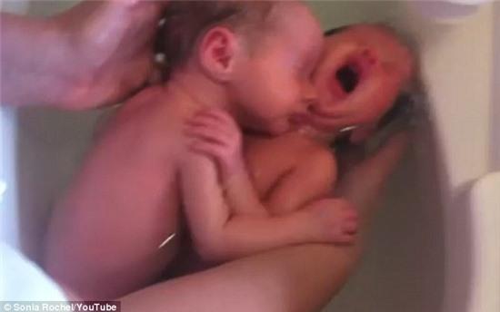 Calming effect: The small bath tub and shower unit, which she spent years creating, is designed to replicate the feeling of being in the womb