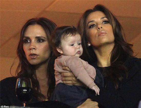Forever entwined: Eva is said to have been 'thrilled' when her bestie asked her to be daughter Harper's godmother - seen here watching Victoria's soccer superstar husband David Beckham play for the LA Galaxy in November 2011