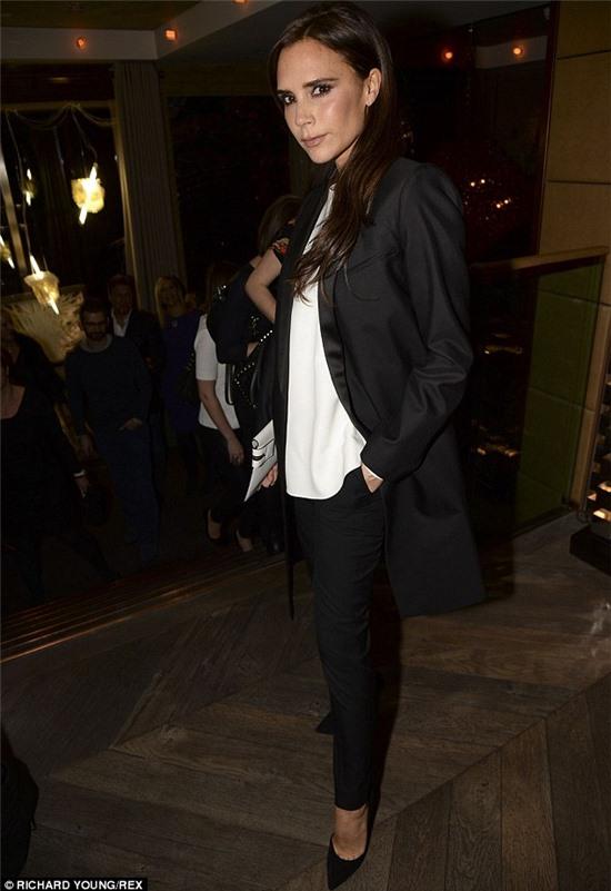 Hanging out: Victoria Beckham wore a baggy suit at the Kelly Hoppen MBE Design Masterclass Book Launch Party in London on Monday