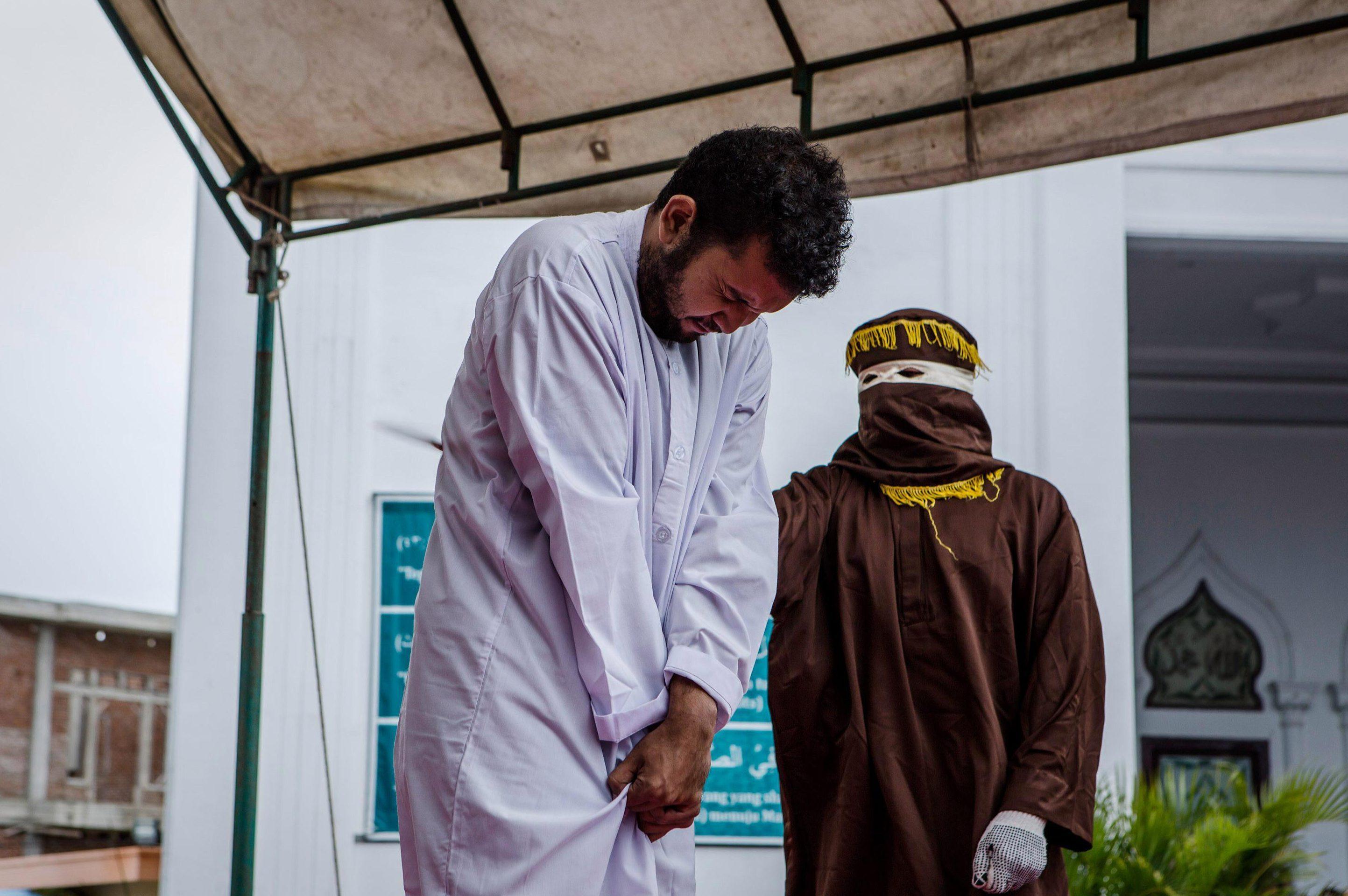 The pair were arrested after a group of vigilantes opposed to homosexuality caught them together