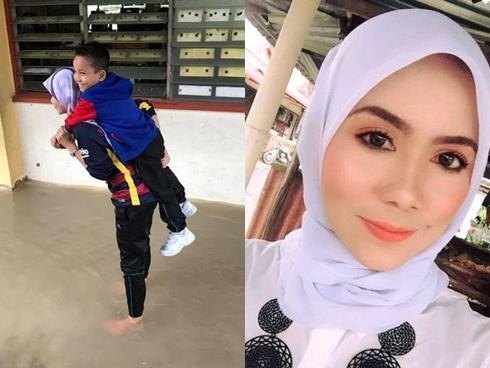 Nữ giáo viên xinh đẹp được khen ngợi vì cõng học sinh qua nước lũ