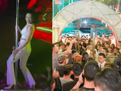 Mỹ Tâm gợi cảm ôm cột lắc tóc khiến quán bar đóng cửa vì quá tải khách