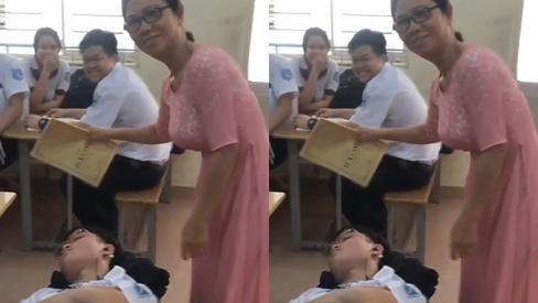 Nam sinh nằm sõng soài ngủ trên ghế trong giờ học, cô giáo không phạt lại xuống tận nơi chăm sóc tận tình-1