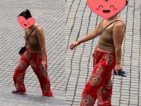 Đã mặc áo 2 dây ngắn cũn cỡn còn thả rông vòng 1 khi đi lễ chùa ở Ninh Bình, người phụ nữ bị dân mạng ném đá tới tấp