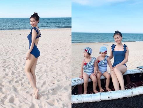 Chụp ảnh cùng 2 con bên bờ biển, 'bà mẹ bỉm sữa' lập tức chiếm spotlight nhờ nhan sắc đánh bật cả hotgirl