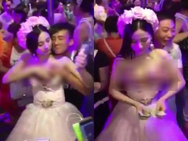 CLIP: Cô dâu ngực khủng để mặc quan khách sờ nắn vòng 1, miệng còn tươi cười thích thú-1