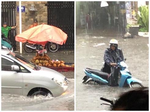 Nước chảy như thác, cuốn phăng người và xe ở Sài Gòn