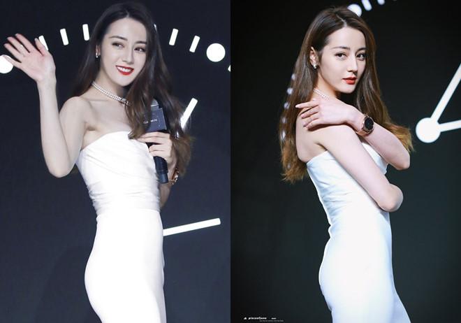 Địch Lệ Nhiệt Ba diện váy cúp ngực, liên tục dùng tay che chắn vòng 1-3