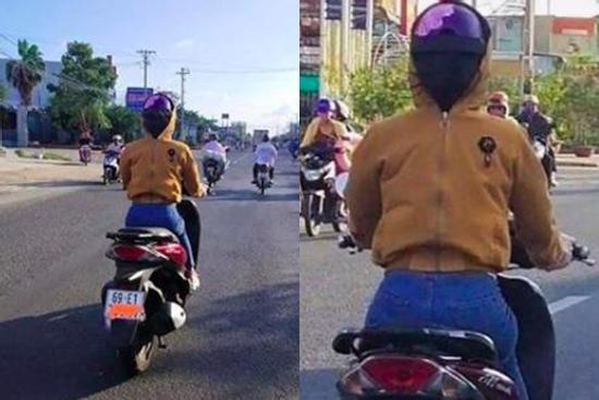 CÁI GÌ ĐÂY: Người phụ nữ ở Cà Mau đi xe máy nhưng đội mũ bảo hiểm ngược và trùm áo kín mặt