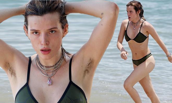 Bella Thorne: Giọng ca 23 tuổi từng có thời gian dài xuất hiện trong các bức ảnh bikini gợi cảm với phần nách gây chú ý. Hồi năm 2017, một fan từng khuyên Bella nên cạo lông để đúng với phong cách "cool ngầu" của cô. Đáp lại, ca sĩ người Mỹ đã nói: "Vậy bạn không biết tôi chẳng bao giờ cạo nó à?". Tuy nhiên, trong loạt ảnh gần đây, phần lông dưới cánh tay dường như đã được cô tỉa bớt. Ảnh: Daily Mail.