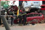 Dừng đèn đỏ ở Hà Nội, ô tô con bị container chồm lên nóc, 3 người tử vong