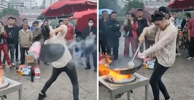 Màn múa chảo như diễn xiếc của cô nàng bán cơm rang bốc lửa khiến ai xem cũng hết hồn-1