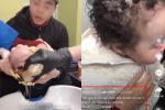 Phẫn nộ bà ghì chặt cháu 1 tuổi để thợ đổ hóa chất lên đầu làm tóc xoăn
