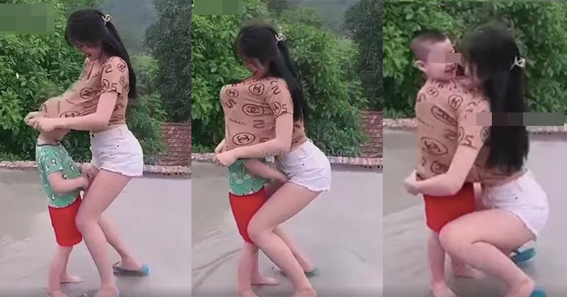 Cô gái gây tranh cãi kéo áo thun trùm lên đầu bé trai rồi ôm sát ngực-1
