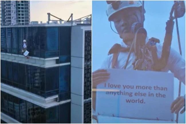 Nhìn ra cửa kính tòa nhà từ tầng 17, cô gái ngạc nhiên khi thấy bạn trai treo lơ lửng-1