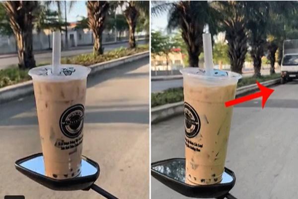 Để cốc trà sữa lên gương xe máy khi di chuyển, thanh niên khiến dân mạng hốt hoảng-1