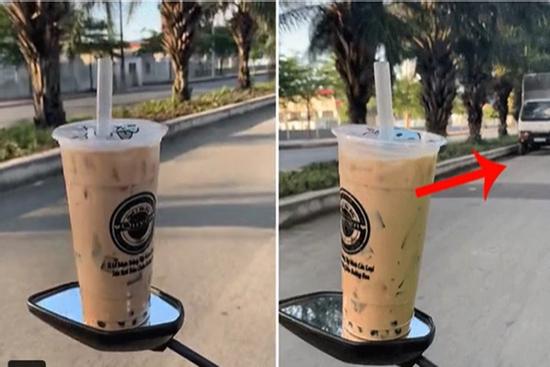 Để cốc trà sữa lên gương xe máy khi di chuyển, thanh niên khiến dân mạng hốt hoảng