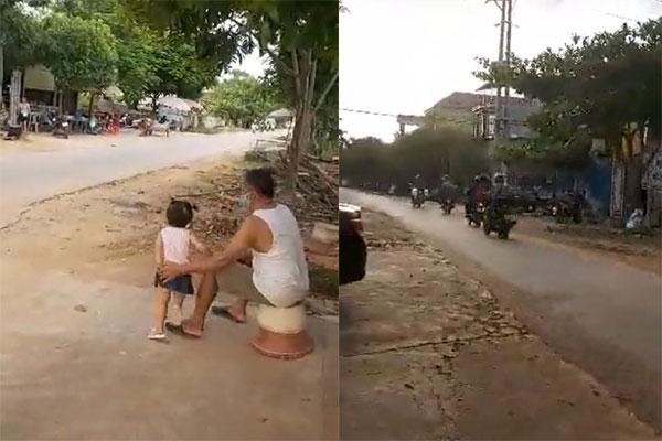 Em bé mặc đồ bảo hộ một mình đợi xe, lỉnh kỉnh đồ đạc đi cách ly-2