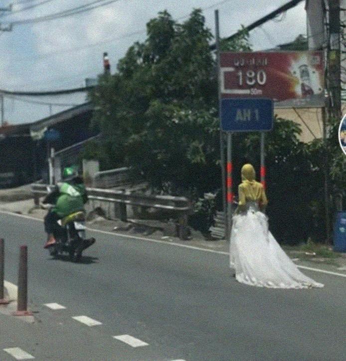 Bí ẩn cô gái mặc váy cưới đi bộ giữa đường xôn xao MXH-1