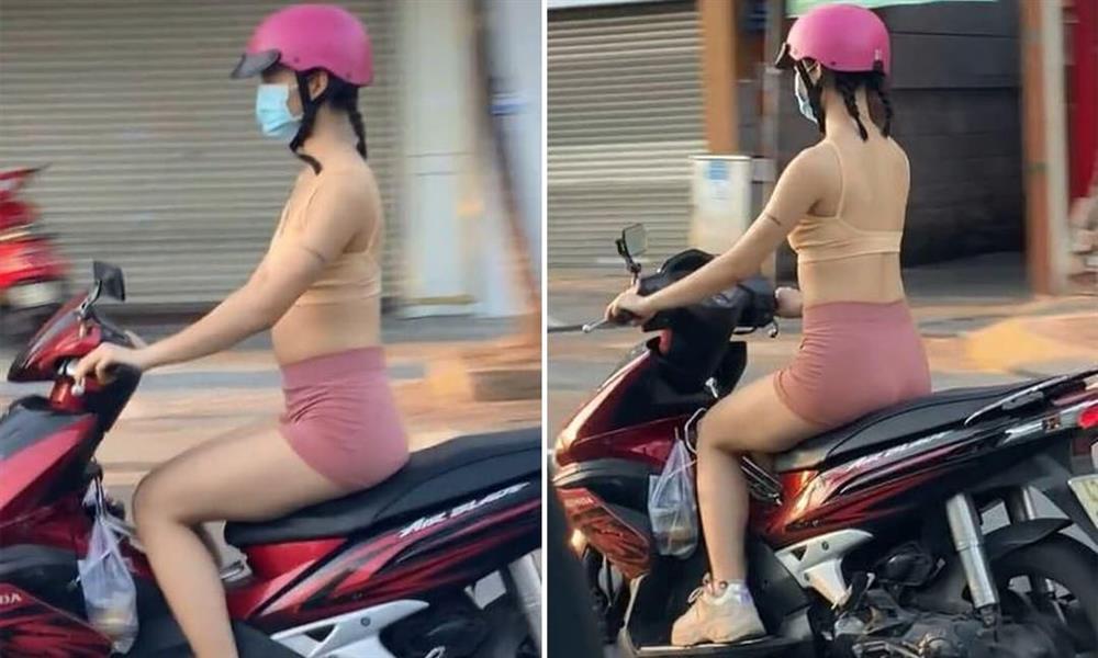 Cô gái mặc bra như bán khỏa thân hồn nhiên chạy xe trên đường-3