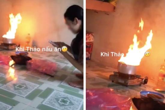 Lửa đang cháy phừng phực, cô gái vẫn tỉnh queo bấm điện thoại