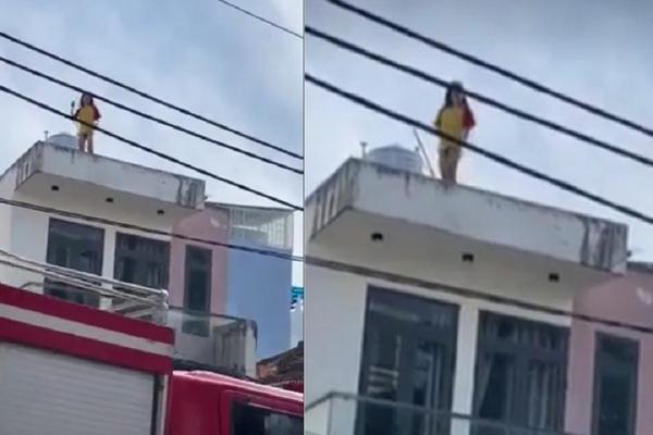Cô gái trẻ lên nóc nhà nhảy múa thoát y, đòi tự tử-2