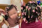 Bé gái 1,5 tuổi khóc ngằn ngặt khi làm tóc xoăn đón Tết