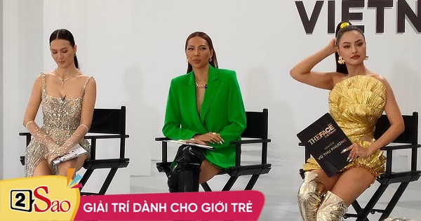 Why does Minh Trieu sit between the two big sisters of the model village?