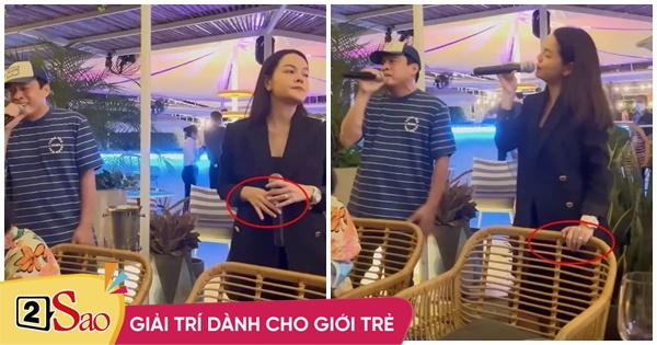 Pham Quynh Anh wears a black dress to hide her pregnant belly, revealing her wedding ring
