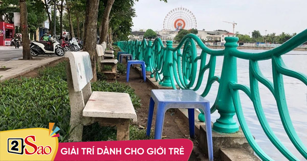 A series of iced tea shops lined up with chairs like a beach in West Lake