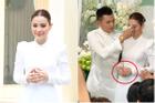 Cô dâu Phương Trinh Jolie mặc áo dài trắng để lộ bàn tay gân guốc