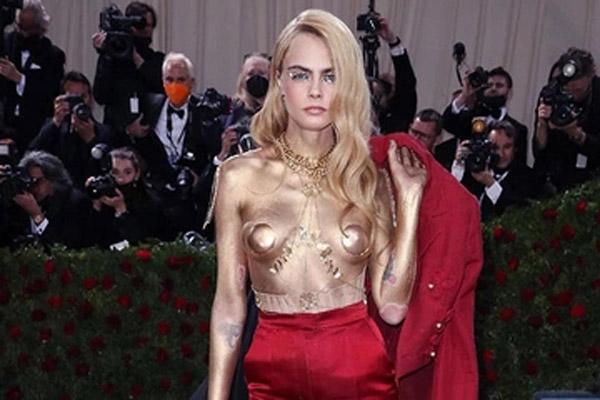 Cara Delevingne goes topless at the Met Gala red carpet