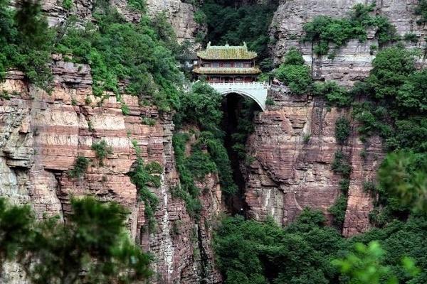 The ancient temple is crammed between two cliffs