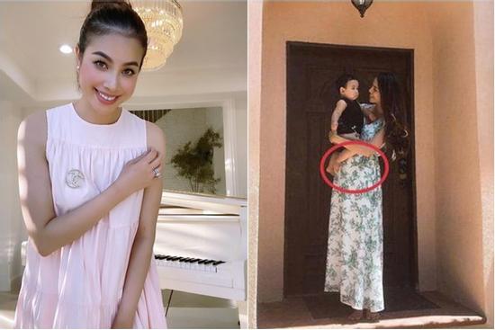 Phạm Hương diện đầm rộng che bụng lùm lùm như bầu lần 3