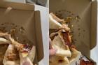 Tranh cãi ầm ĩ chiếc pizza dính chặt trên nắp hộp, rơi hết topping