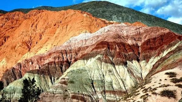 What are the brilliant colors of the fairy-like rainbow mountains in Peru painted with?-3