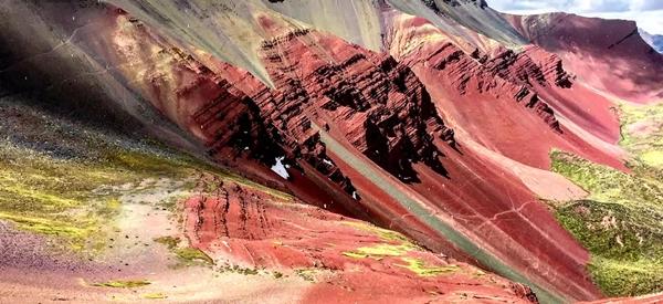 What are the brilliant colors of the fairy-like rainbow mountains in Peru painted with?-5