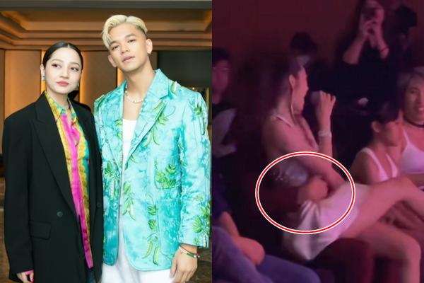 Bao Anh sat on Trong Hieu’s lap, the boy’s spoiled hand