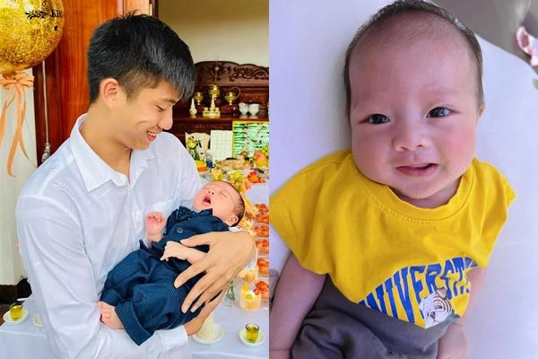 Phan Van Duc’s expression of petting his son over 1 month old